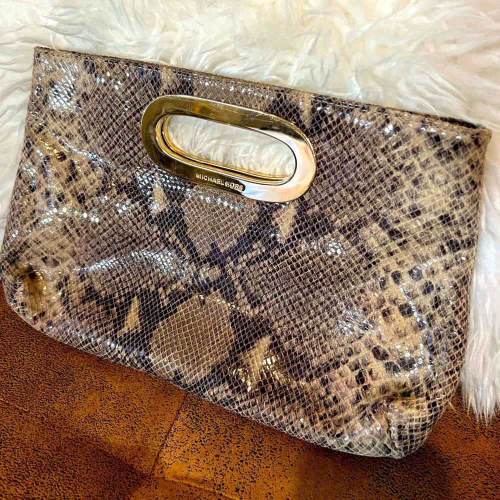 Michael Kors snakeskin clutch. Black/brown/tan variation with gold handle.